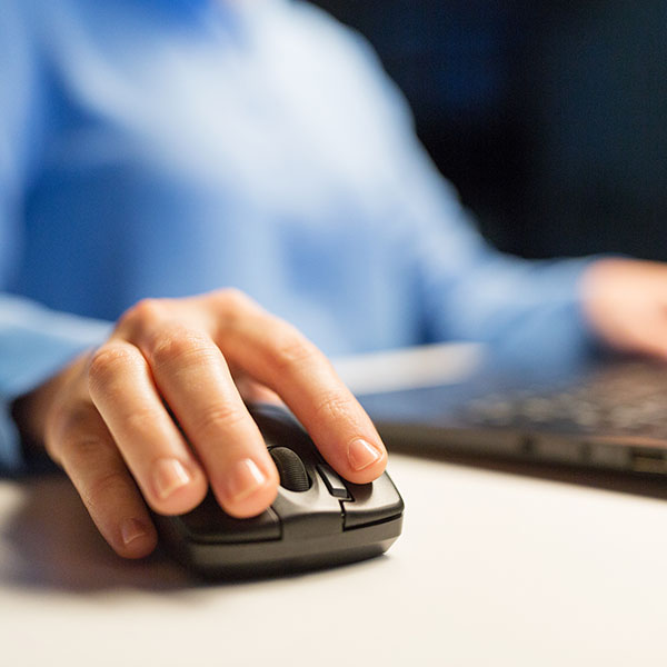 Cyber Security - Close up shot of a businessman clicking a mouse.
