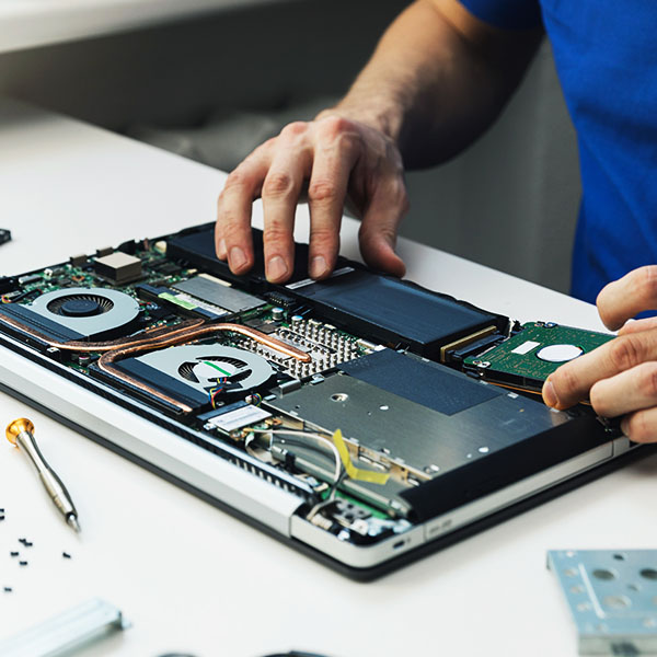 An IT support technician is attempted to recover data from a damaged hard drive.